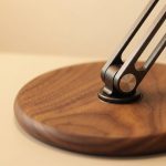 Adjustable Walnut Phone & Tablet Stand in a warm desk setup