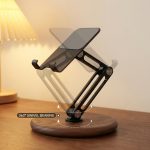 Adjustable Walnut Phone & Tablet Stand in a warm desk setup