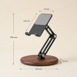 Adjustable Walnut Phone & Tablet Stand in a warm desk setup