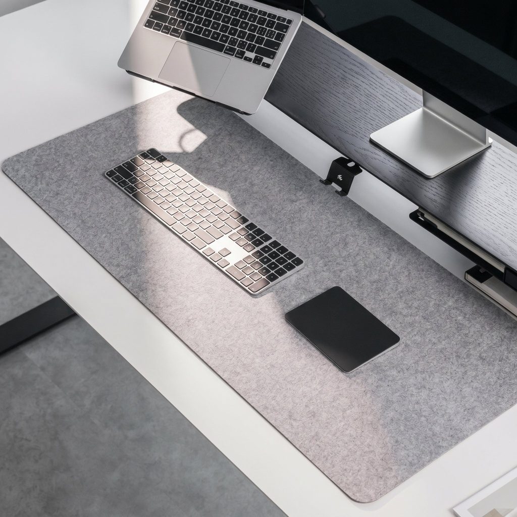 Reversible Felt & Cork Desk Mat in a warm desk setup